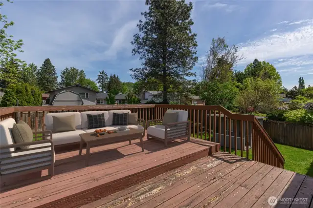 Enjoy the large deck perfect for outdoor living. Virtually staged.