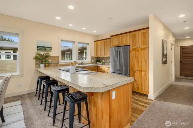 The eat-in kitchen offers a seamless transition between spaces, creating an inviting and functional layout.