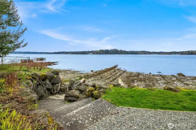 The stairs provide convenient access to the shared beach, allowing for easy enjoyment of the waterfront and creating a welcoming space for outdoor recreation and relaxation.