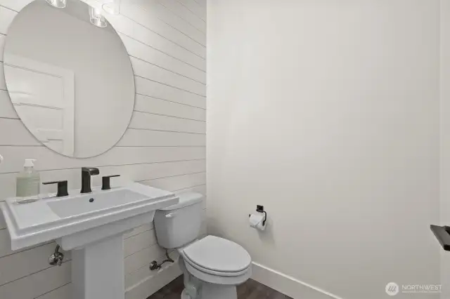 1/4 bath next to primary, utility and garage.