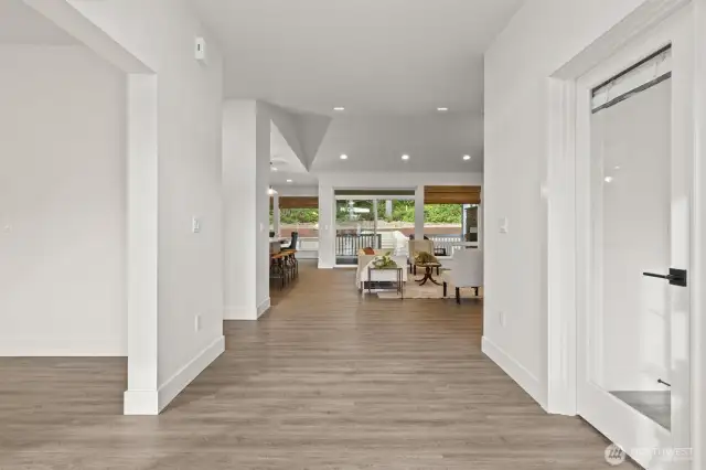 Entryway leading to den on the right & family room on the left