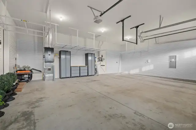 Lots of storage opportunities; slatted wall panels and overhead bins