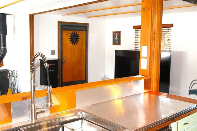 A kitchen view to front door.