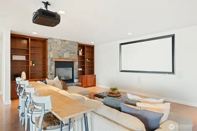 Lower level family room with projector & gas fireplace.