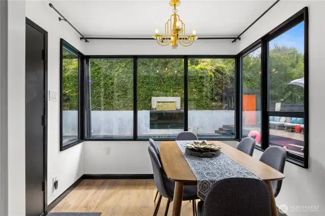 Dining space overlooks the pool. Such a convenient way to be inside and outside at the same time.