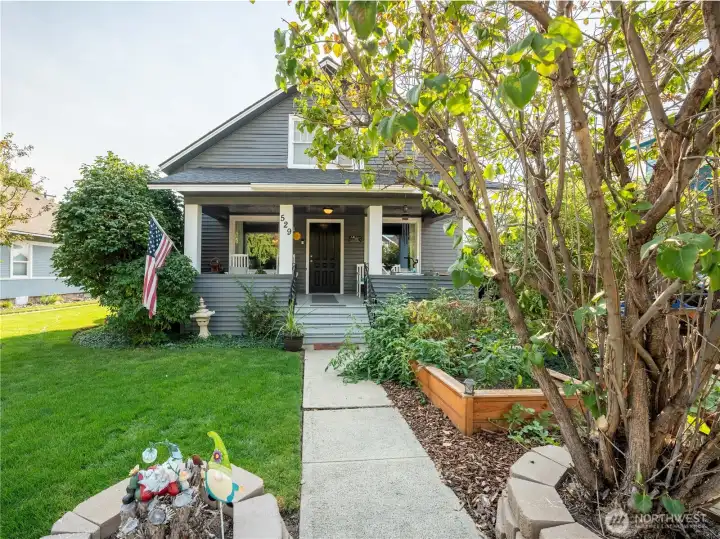 Spacious covered porch perfect for year-round enjoyment, offering shade in summer and shelter in winter.