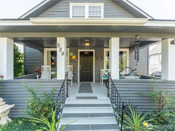Charming covered front porch enhances curb appeal while providing a comfortable spot to enjoy morning coffee.
