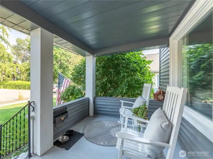 Classic 1922 Tudor charm highlighted by a spacious covered front porch with timeless details.