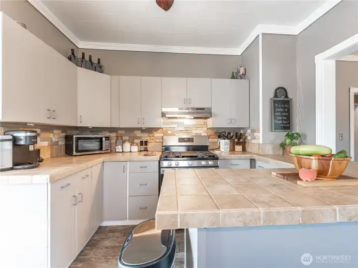 Light and bright kitchen with convenient layout and nearby laundry room.