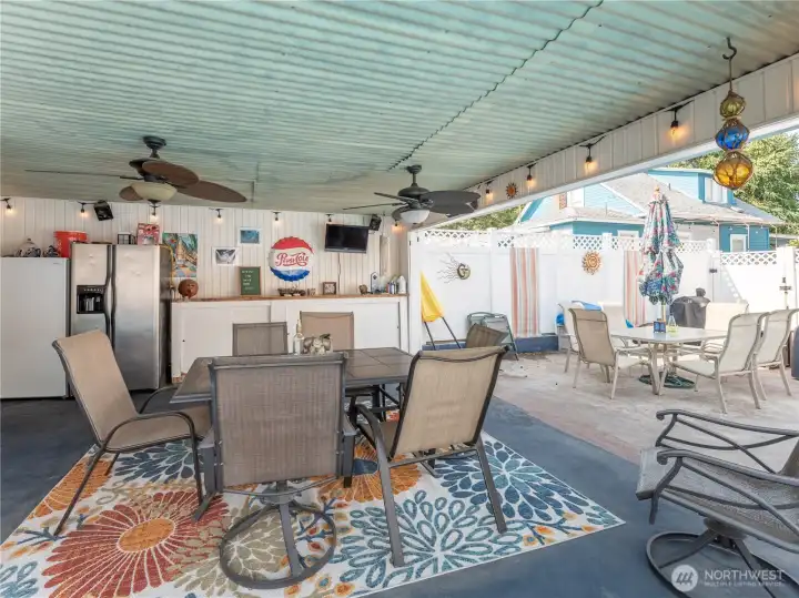 Convenient poolside cabana creates shade and comfort for entertaining guests.