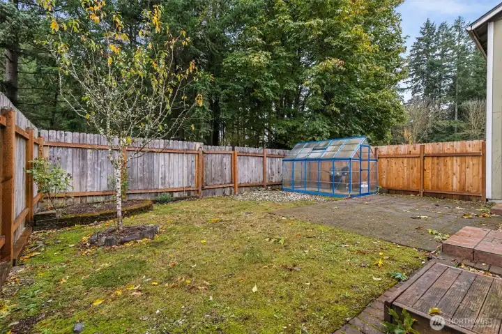 Fully Fenced Backyard with Green House