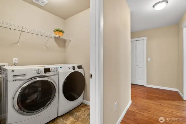 Laundry Room comes with froont load washer and dryer
