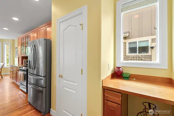 Large Pantry in the Kitchen next to small workstation.
