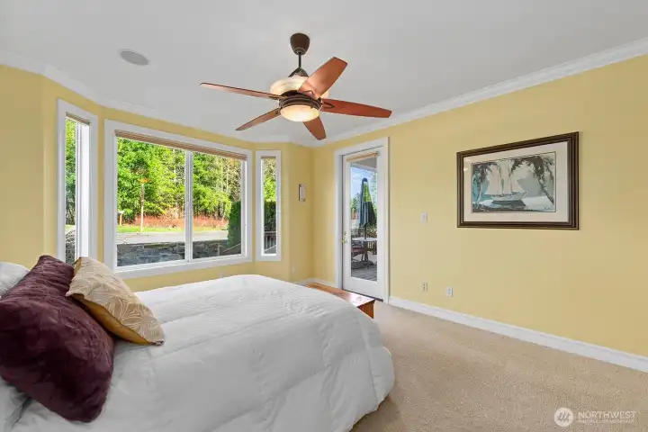 Primary Bedroom with large picture windows and glass door access to Deck.