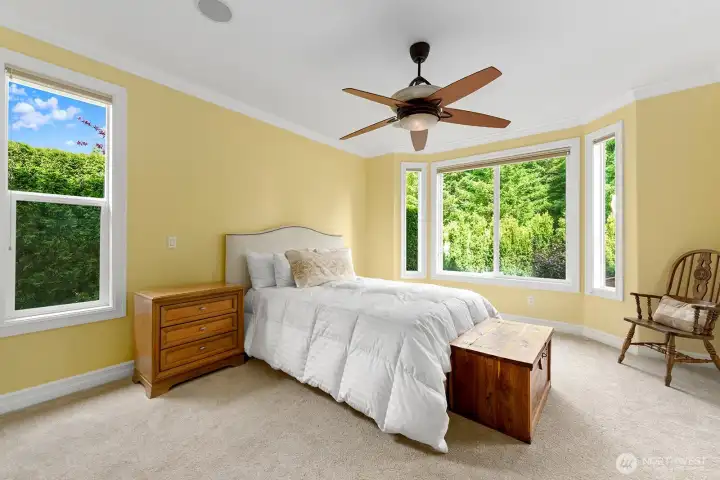 Generous primary suite is filled with bright natural light.  An abundance of space which will easily accommodate a king-sized bed plus full-sized furniture.