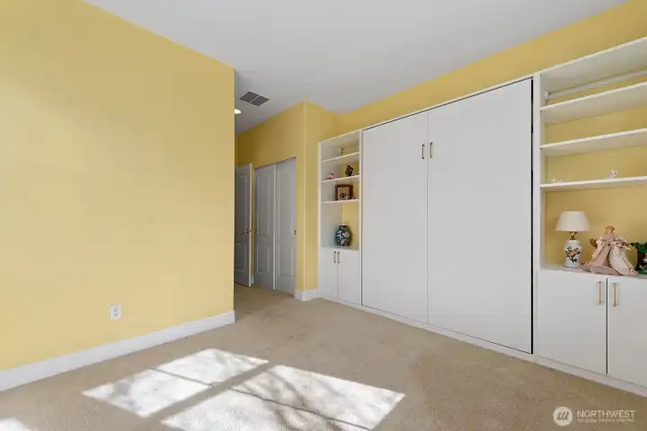Guest Bedroom with Murphy Bed and built-in storage.