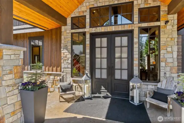 A pair of soaring 8-ft iron and glass doors make an immediate statement, swinging fully open with operable glass panels that welcome the mountain air inside. A pair of soaring 8-ft iron and glass doors make an immediate statement, swinging fully open with operable glass panels that welcome the mountain air inside.