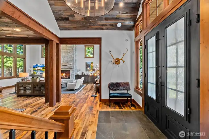 Vaulted ceiling entrance with a metal and glass Restoration Hardware chandelier to welcome you and your guests. Vaulted ceiling entrance with a metal and glass Restoration Hardware chandelier to welcome you and your guests.