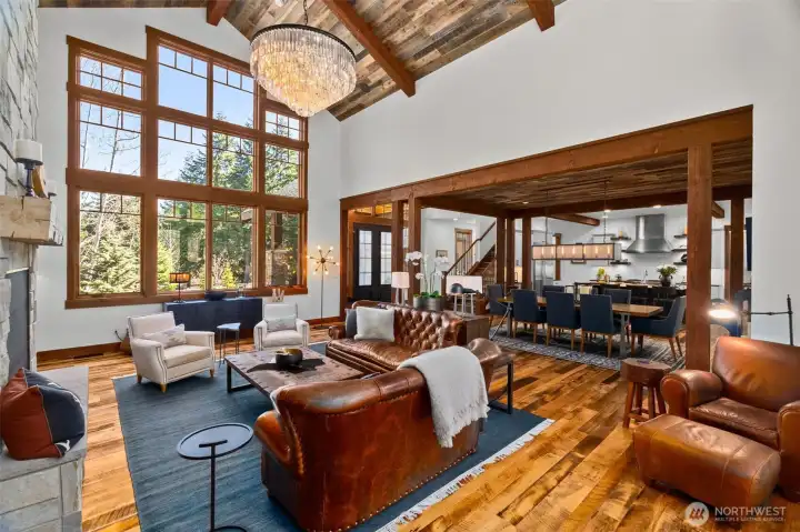 Warm and welcoming with a seamless view through the dining room and into the kitchen, perfectly capturing the open and connected flow of this beautiful space. Reclaimed fence-post shiplap wood vaulted ceilings in the great room, formal dining and foyer. Warm and welcoming with a seamless view through the dining room and into the kitchen, perfectly capturing the open and connected flow of this beautiful space. Reclaimed fence-post shiplap wood vaulted ceilings in the great room, formal dining and foyer.