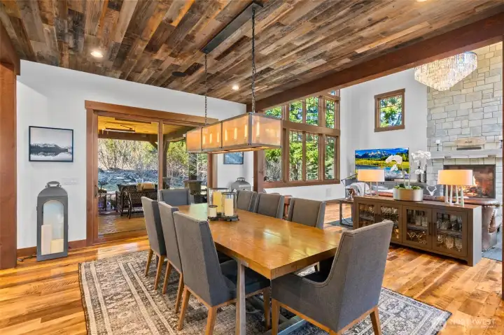 The formal dining room can seat 12 with views through the covered patio to the mature native landscaping. The formal dining room can seat 12 with views through the covered patio to the mature native landscaping.