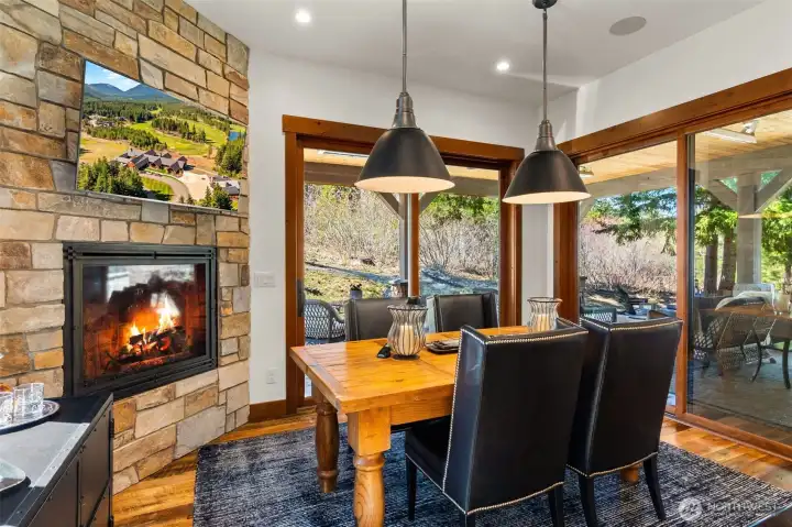 Elevate everyday dining with a floor-to-ceiling stone fireplace, TV and double sliders that open directly to the covered patio and BBQ. Elevate everyday dining with a floor-to-ceiling stone fireplace, TV and double sliders that open directly to the covered patio and BBQ.