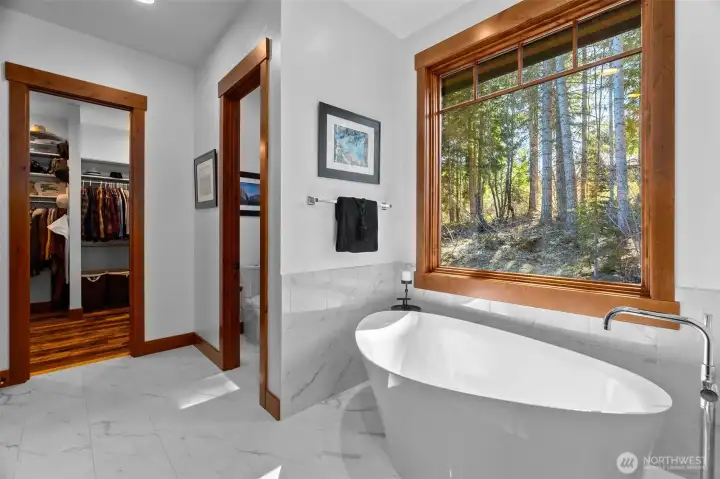 Indulge in the uniquely shaped freestanding Kohler soaking tub. Indulge in the uniquely shaped freestanding Kohler soaking tub.