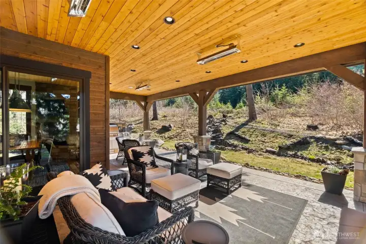 Entertain in comfort year-round with Infratech heaters on the covered patio and balcony, plus an outdoor cook space complete with a Fire Magic grill and side burner. Entertain in comfort year-round with Infratech heaters on the covered patio and balcony, plus an outdoor cook space complete with a Fire Magic grill and side burner.