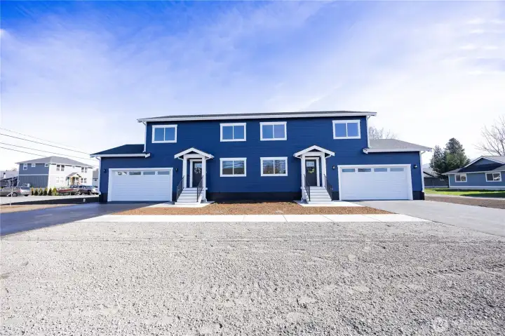 2-Unit condo complex. Gravel area is shared extra parking spaces