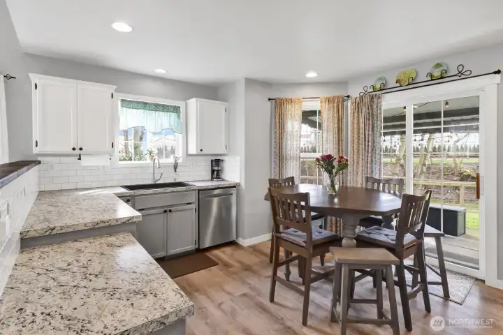Charming kitchen with all appliances included and a slider door that opens to a covered patio—perfect for indoor-outdoor living.