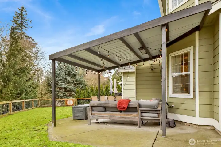 Covered patio—your go-to spot for grilling, shade, and shelter no matter the weather.
