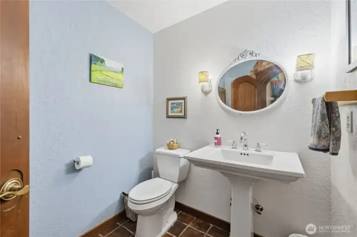 Powder room off the entry way
