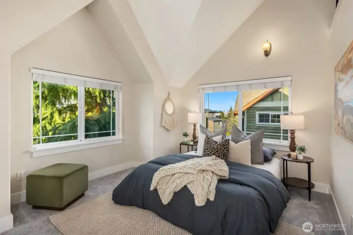 Glimpses of the Cascade Mountains on clear days from the primary bedroom East window and the loft above.