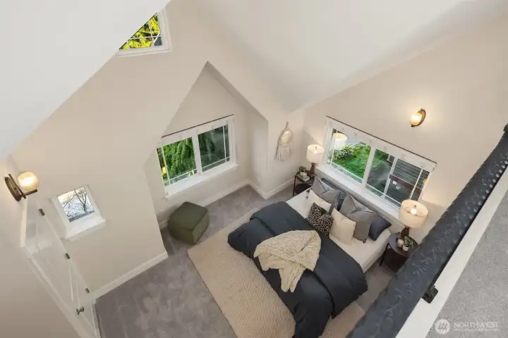 Vaulted ceilings and filled with natural light - this primary ensuite bedroom is a dreamy space to relax.