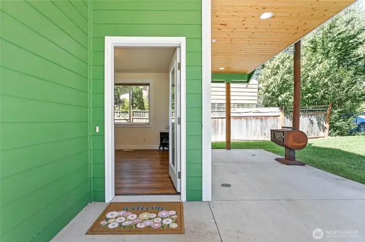 Front entry & large covered porch with wood stove to enjoy year around.