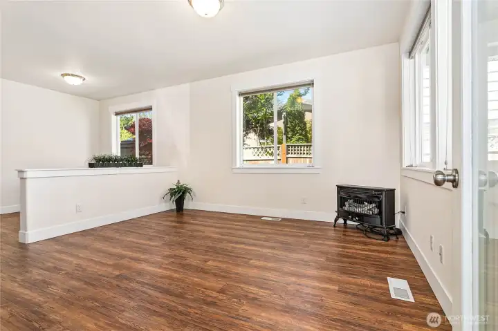 Living room has a gas stove for cozy ambiance & warmth.