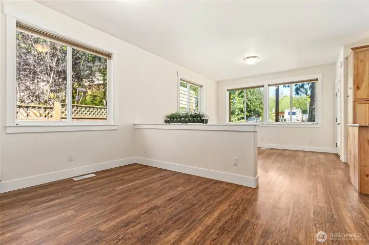 A half wall separates the dining from the living area