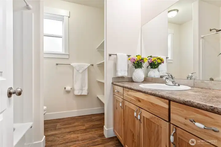 Main full bath has two sinks & oversized tub