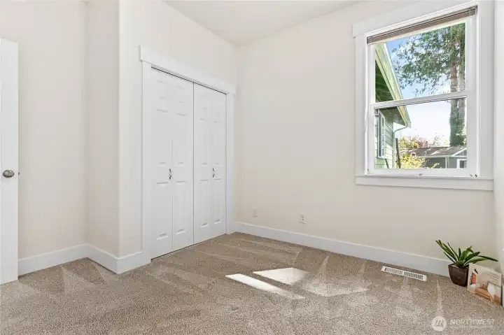 Bedroom #2 overlooks the side yard.
