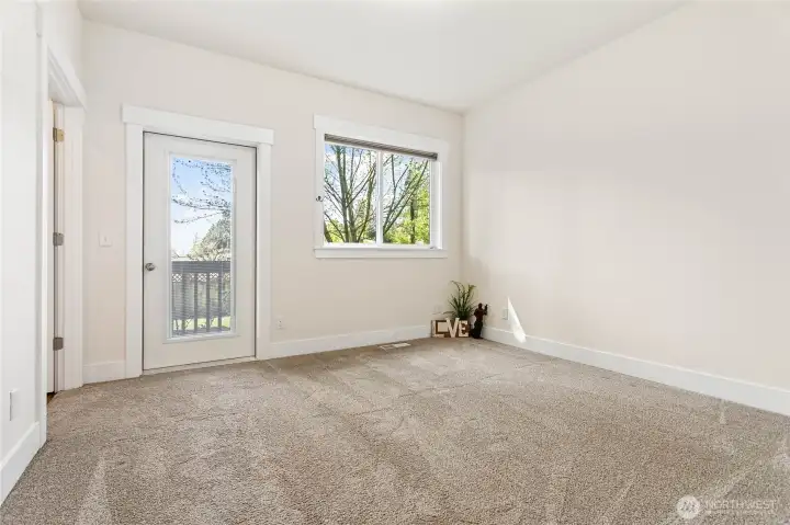 Primary bedroom with backyard access.