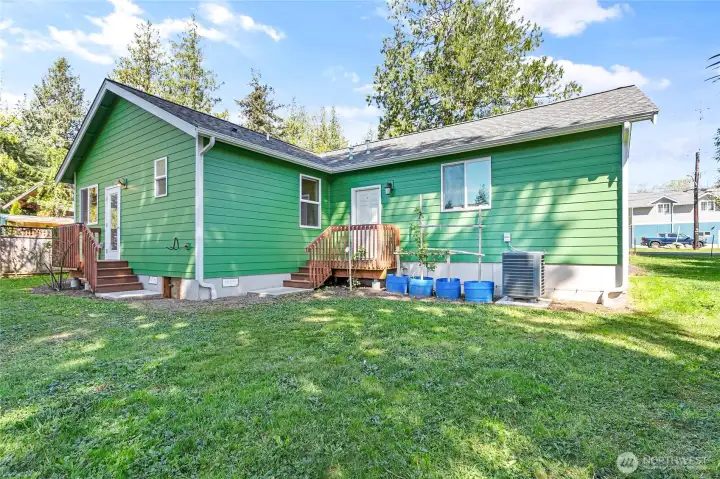 Back of the home. The steps to the left lead to the primary bedroom.