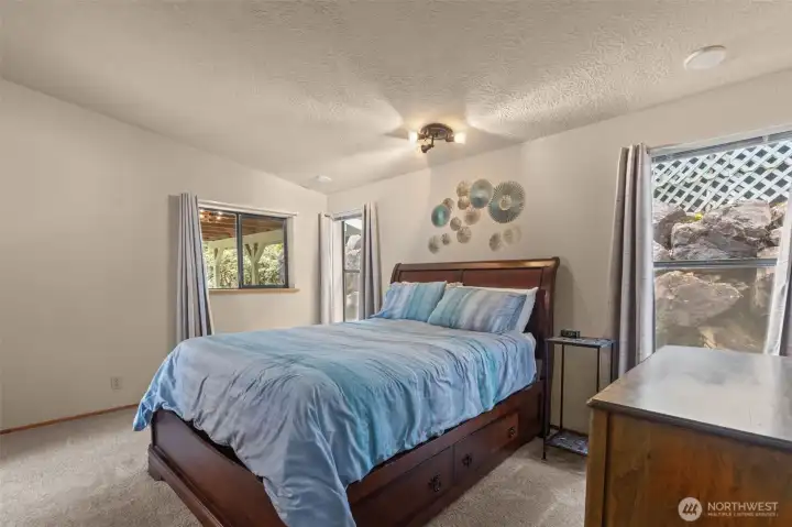 large master bedroom with walk in closet and en suite bathroom
