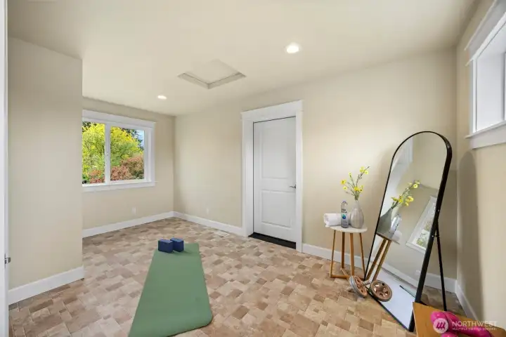 Bonus room upstairs, staged as home gym.