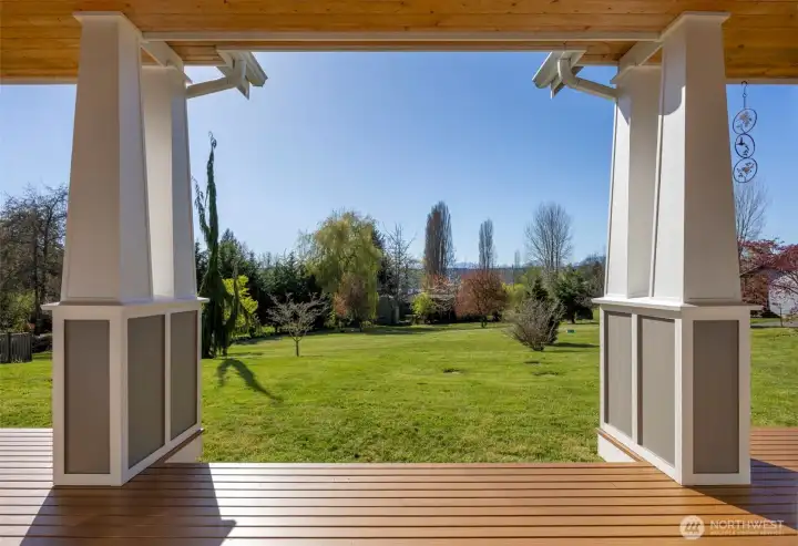 Back deck, looking towards Mt. The yard is partially fenced but has stakes so you can clearly see property size & how large the lot is. Just minutes to town, this home still provided privacy & tons of natural beauty.