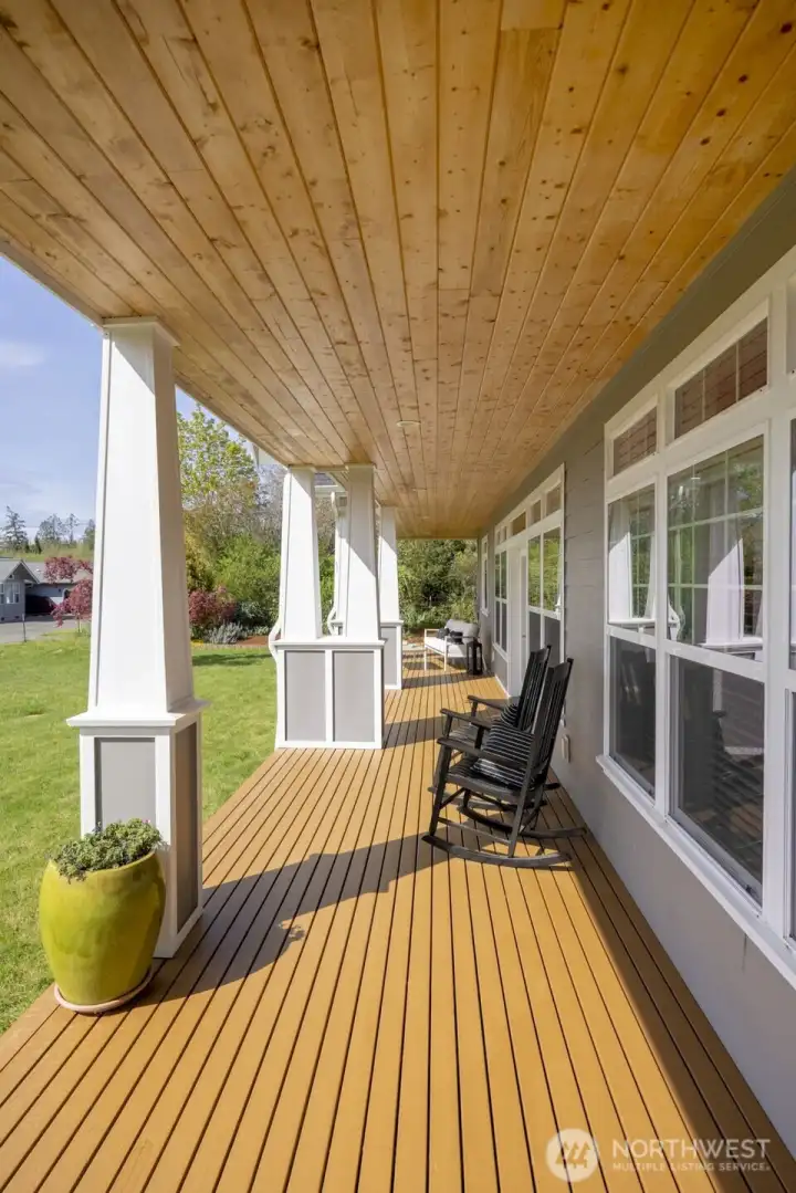 Back covered porch with French doors opening into the main living space, or continue along the wraparound porch for direct access into the kitchen.
