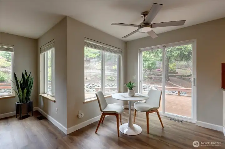 Informal dining area with sliding glass door leading to the backyard.