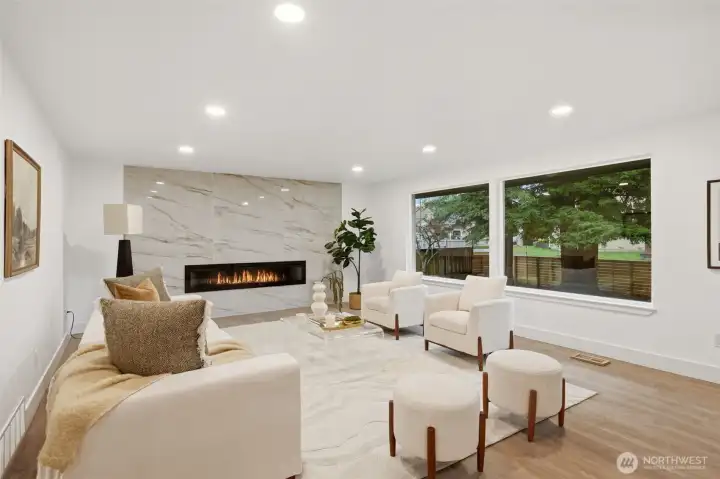 Upstairs living room, new fireplace and huge windows