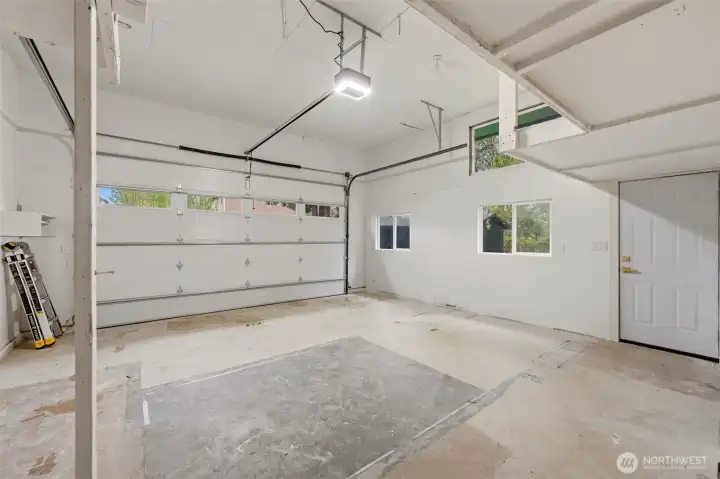 Huge garage with tall ceilings. Brand new door and opener.