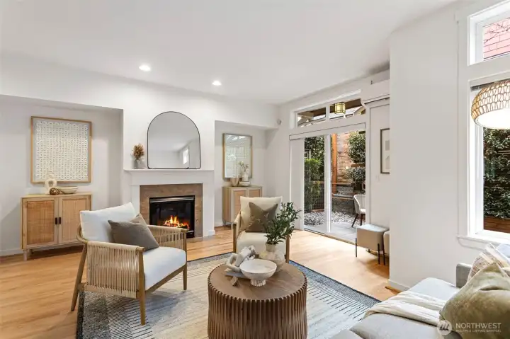 Rarely available Ravenna Court townhomes are architecturally stunning and this one features a 2 car tandem garage.