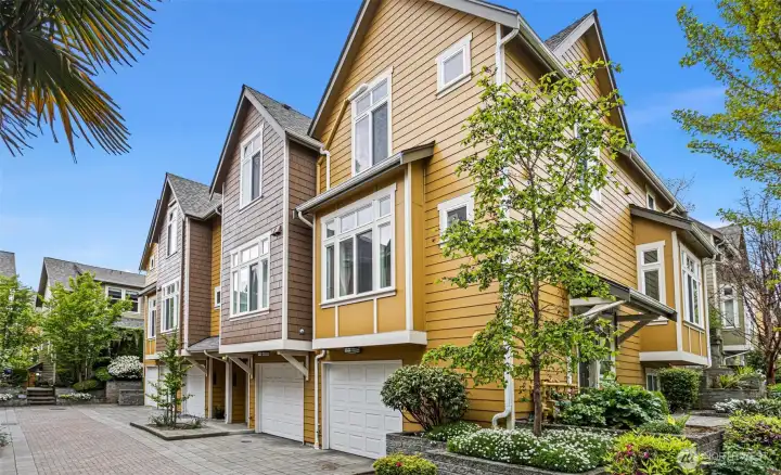 Ravenna Court townhomes once housed Saxe Nursery and feature beautiful landscaping throughout the project.