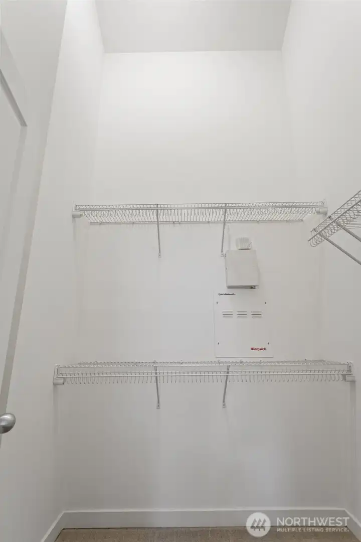 Each upstairs primary suite (there are two) features a large walk-in closet, also with vaulted ceilings.